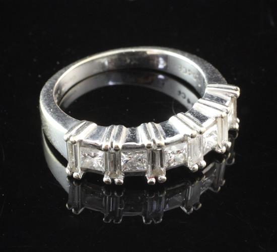 An 18ct white gold and diamond half hoop ring, size L.